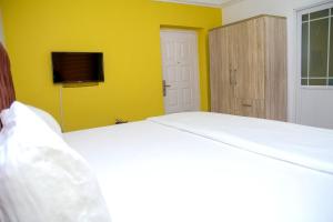 Ένα ή περισσότερα κρεβάτια σε δωμάτιο στο AMPM Suites & Apartments International +7 φωτογραφίες