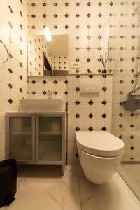 a bathroom with a toilet and a sink at Apartment Vanja konoba in Komiža +18 photos