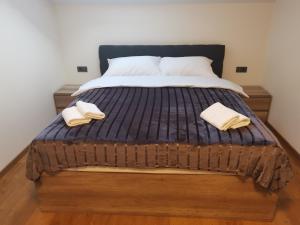Ein Bett oder Betten in einem Zimmer der Unterkunft Nibela Apartments