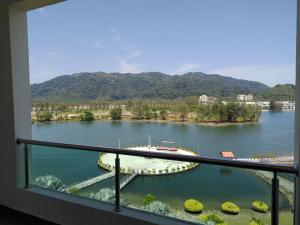 a view of a lake from a balcony at Marina Island Couple Home Stay in Lumut