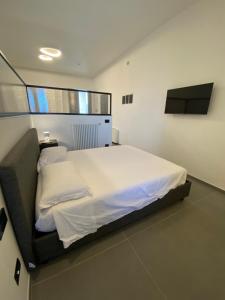 Ліжко або ліжка в номері Archihouse Suites