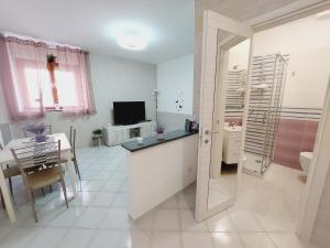 A television and/or entertainment centre at Butterfly Appartamento