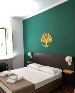 Ένα ή περισσότερα κρεβάτια σε δωμάτιο στο Il Piccolo Albergo Matera