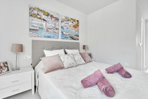 En eller flere senge i et værelse på Apartment Golden Luna