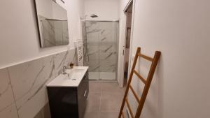 a bathroom with a sink and a shower at Maison D’aMi’ in Termoli +13 photos