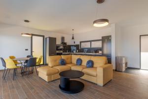 a living room with a couch and a table at Casa Mozart I in Estreito da Calheta