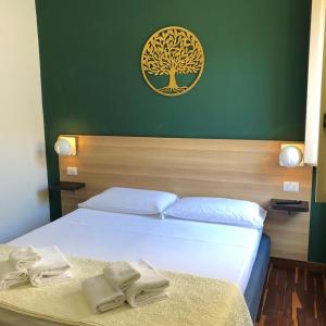 Postel nebo postele na pokoji v ubytování Il Piccolo Albergo Matera