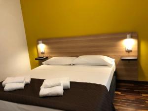 Postel nebo postele na pokoji v ubytování Il Piccolo Albergo Matera