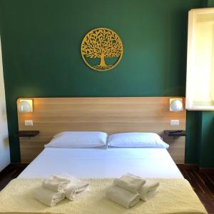 Postel nebo postele na pokoji v ubytování Il Piccolo Albergo Matera