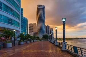 a city with tall buildings and a street light at Ecusuites Studio Two Riverfront con Jacuzzi Hidro Privado in Guayaquil