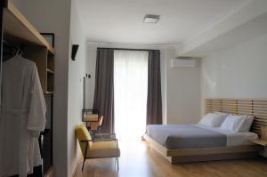 Postel nebo postele na pokoji v ubytování Theoxenia Hotel
