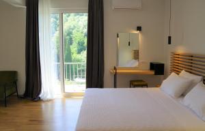 Postel nebo postele na pokoji v ubytování Theoxenia Hotel