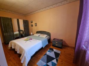 a bedroom with two beds and a wooden floor at Gordana in Reims