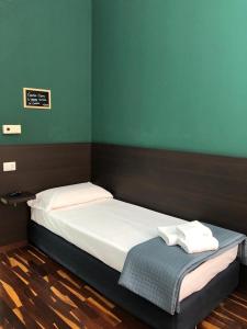 Postel nebo postele na pokoji v ubytování Il Piccolo Albergo Matera