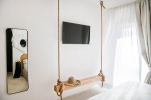 Televízia a/alebo spoločenská miestnosť v ubytovaní Una Villa - Amalfi Boutique Rooms B&B