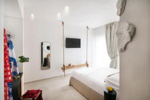 Posteľ alebo postele v izbe v ubytovaní Una Villa - Amalfi Boutique Rooms B&B