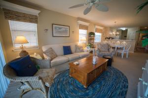 a living room with a couch and a coffee table at True Blue Golf Resort in Pawleys Island