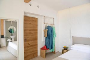 Posteľ alebo postele v izbe v ubytovaní Una Villa - Amalfi Boutique Rooms B&B