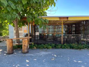 a wooden bench sitting in front of a library at Una Apartment Cetinje in Cetinje