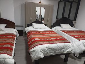 Hostal Killaly Inn Cusco客房内的一张或多张床位
