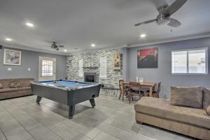 a living room with a pool table in it at Ultimate Phoenix Group Getaway Patio and Pool! in Phoenix