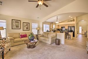 a living room with a couch and a table at Chic Maricopa Getaway with Outdoor Oasis and Pool in Maricopa