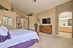 a large bedroom with a bed and a tv at Chic Maricopa Getaway with Outdoor Oasis and Pool in Maricopa