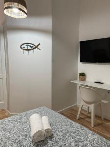 TV a/nebo společenská místnost v ubytování Aria di mare