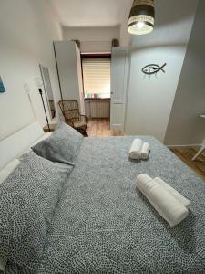 Postel nebo postele na pokoji v ubytování Aria di mare