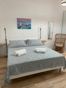 Postel nebo postele na pokoji v ubytování Aria di mare