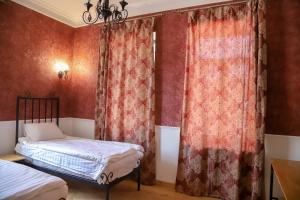 Postel nebo postele na pokoji v ubytování Nur Guest House