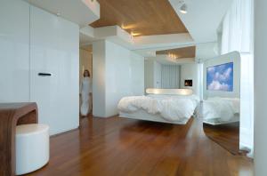 Letto o letti in una camera di i-Suite Hotel