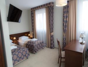 Postel nebo postele na pokoji v ubytování Hotel Imperial Residence