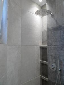 a bathroom with a shower with a glass door at Enjoy B-52 Studio in Belgrade
