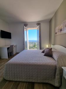 Säng eller sängar i ett rum på Agriturismo Monte Oliveto