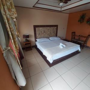 Кровать или кровати в номере Hotel Torre Fuerte