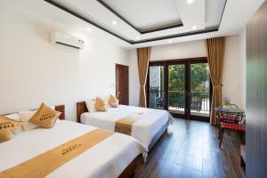 Ένα ή περισσότερα κρεβάτια σε δωμάτιο στο NaFaLa Homestay