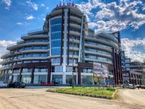 a large office building with a lot of windows at Aparthotel Happy in Primorsko