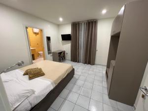 Posteľ alebo postele v izbe v ubytovaní Akoya Rooms Capo Vaticano