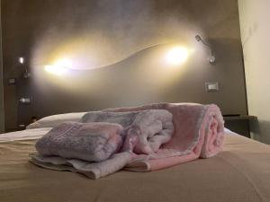 Posteľ alebo postele v izbe v ubytovaní Akoya Rooms Capo Vaticano