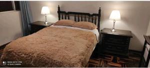 Postel nebo postele na pokoji v ubytování Apart Hotel San Borja