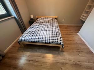 Łóżko lub łóżka w pokoju w obiekcie Apartamenty Pod Jaworami