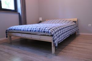 Łóżko lub łóżka w pokoju w obiekcie Apartamenty Pod Jaworami