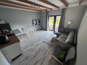 Telewizja i/lub zestaw kina domowego w obiekcie Apartamenty Pod Jaworami