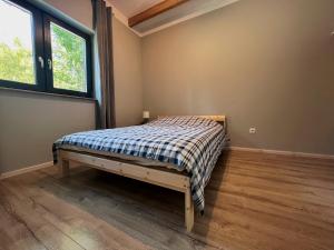 Posteľ alebo postele v izbe v ubytovaní Apartamenty Pod Jaworami