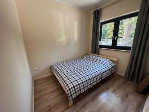 Łóżko lub łóżka w pokoju w obiekcie Apartamenty Pod Jaworami
