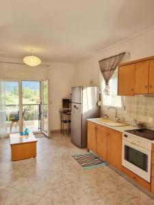 A kitchen or kitchenette at Physis - Seaview Maisonette