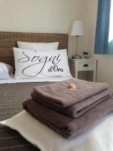 Postel nebo postele na pokoji v ubytování La Terra dei Mari Room & Relax