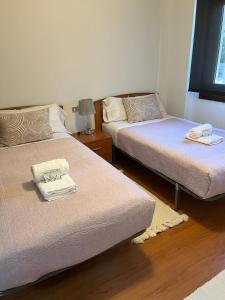 Кровать или кровати в номере Patos Beach III - Olas