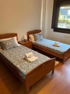 Кровать или кровати в номере Patos Beach III - Olas